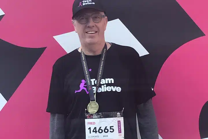 CEO Fred smiling with a medal on after running the Toronto marathon